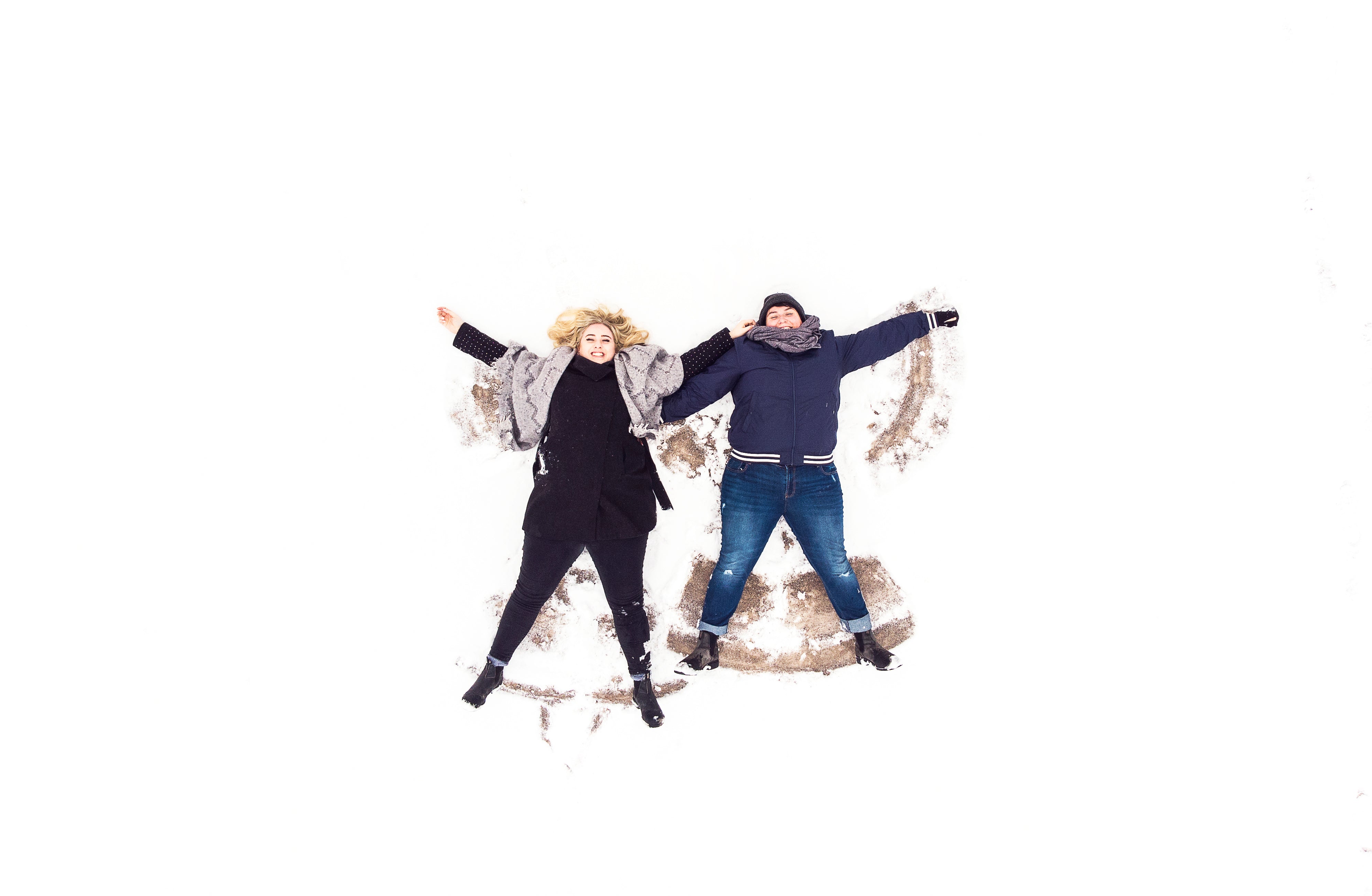 two-women-on-their-backs-in-the-snow.jpg